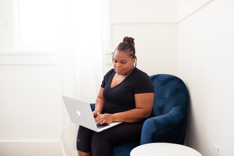 woman browsing laptop for pelvic floor therapy for endometriosis