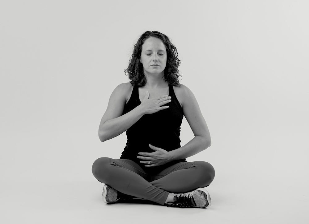 woman breathing deeply to relieve stress and pelvic floor tension