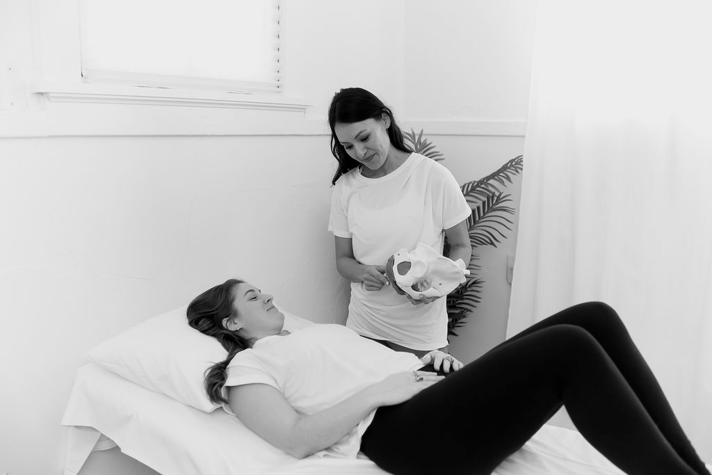 therapist explaining interstitial cystitis pelvic floor exercises